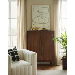 Poltrona In Boucle Con Piedini In Legno Antonio